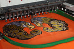 Custom embroidered logo on a orange sweatshirt by Print View