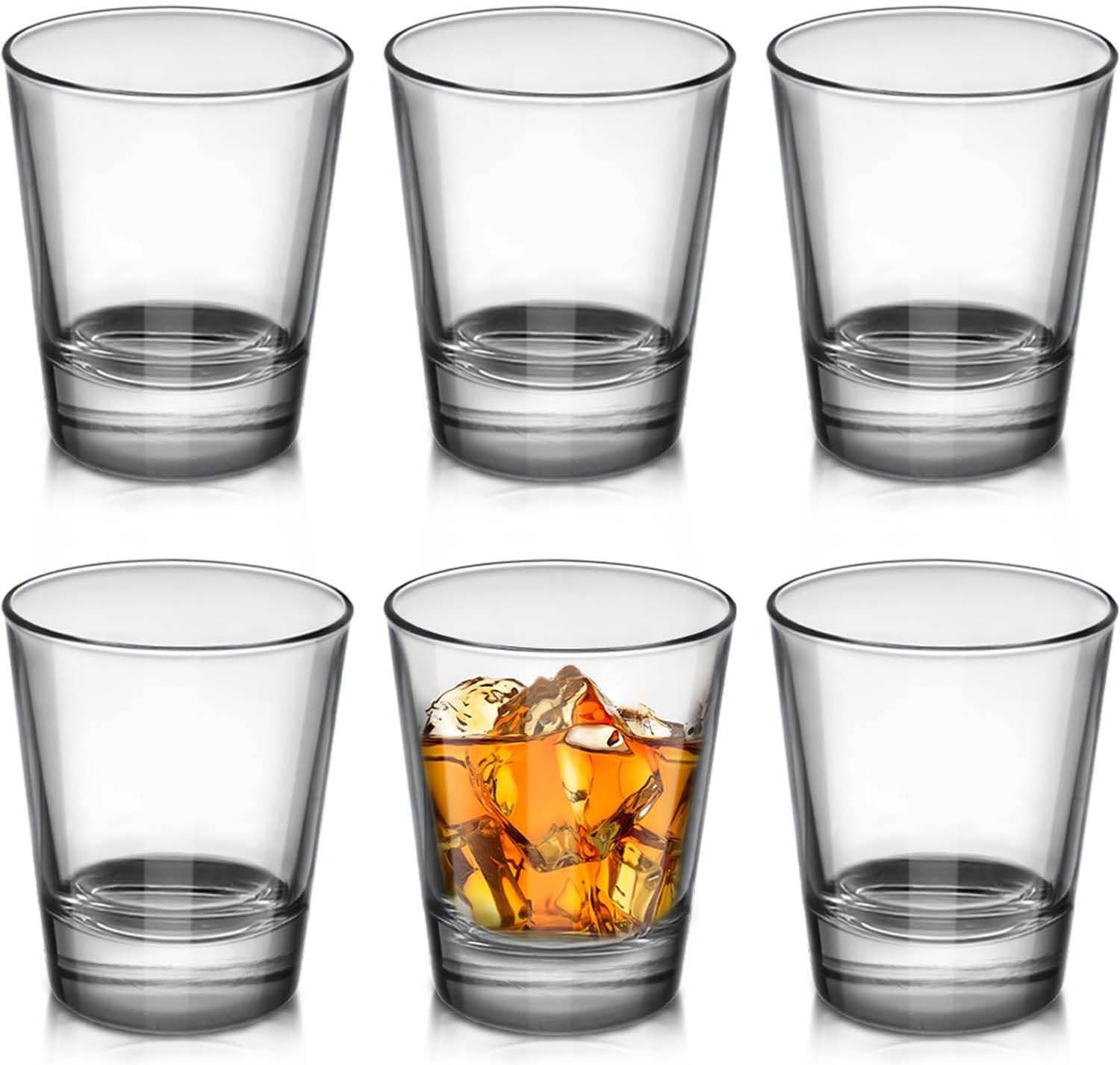 Six clear shot glasses by Print View, plain or customizable, made of glassware perfect for beverages and events.