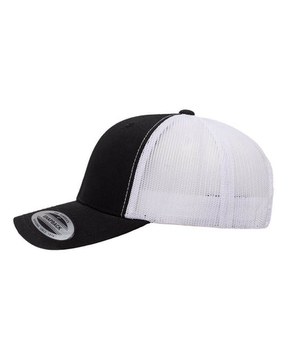Black and white Yupoong YP Classics retro trucker cap with custom embroidered logo on front, mesh back for ventilation.