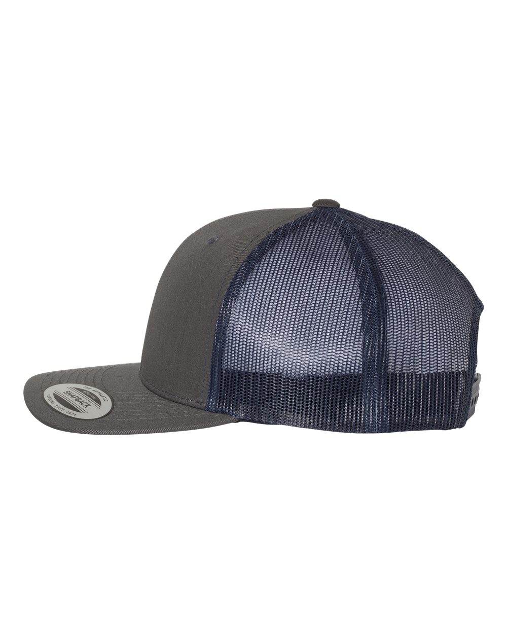 Charcoal and navy Yupoong YP Classics retro trucker cap with personalized embroidered logo on front, adjustable snapback closure