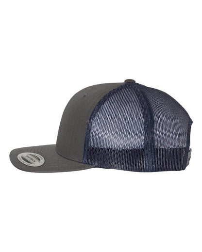 Charcoal and navy Yupoong YP Classics retro trucker cap with personalized embroidered logo on front, adjustable snapback closure