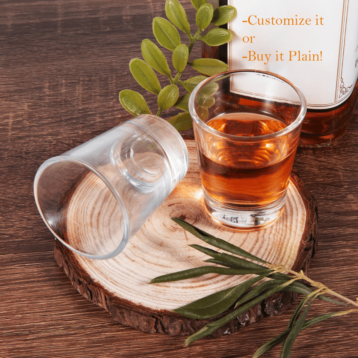 Clear shot glasses by Print View, customizable glassware for drinks, shown in plain and personalized options.