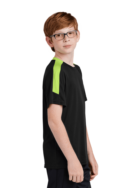 Black and lime green custom youth soccer jersey by Sport-Tek with space for name, number, and team logo, shown from side view.