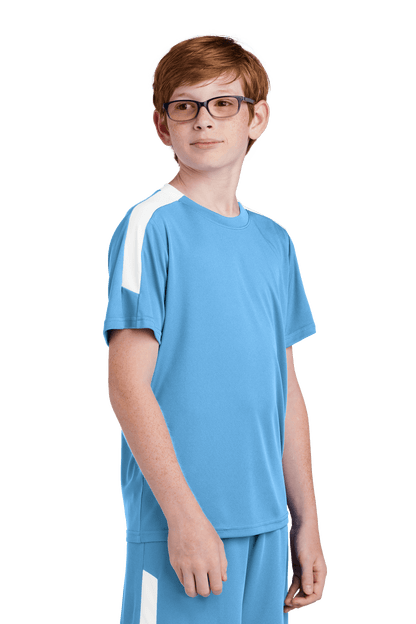 Sport-Tek custom youth soccer jersey in Carolina blue and white with team logo, name, and number print on side view.