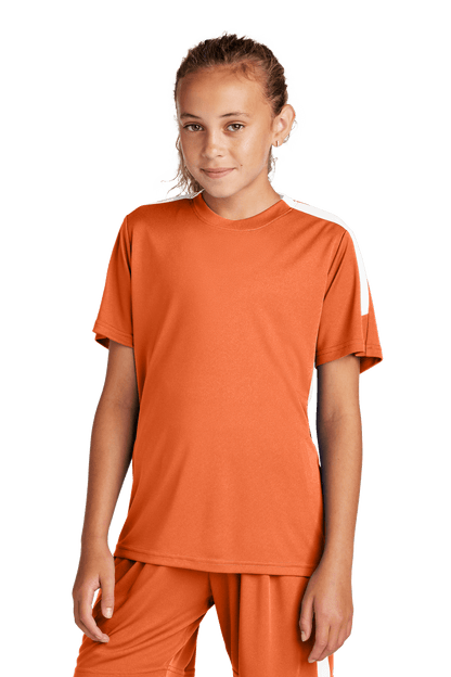Youth soccer jersey by Sport-Tek featuring orange and white colors, customizable with name, number, and team logo.