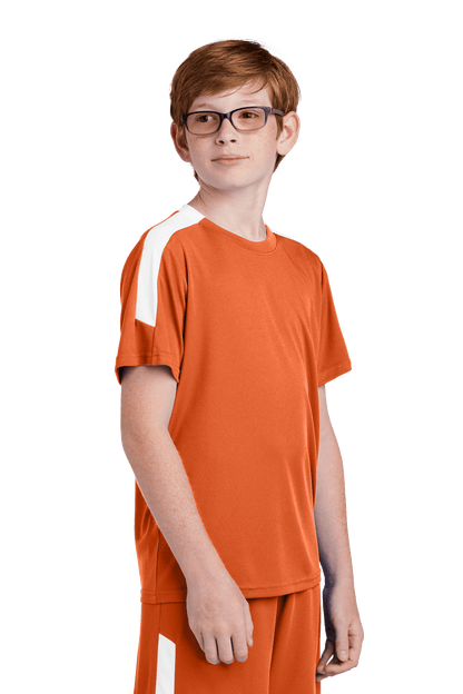 Custom Youth Soccer Jersey by Sport-Tek featuring orange and white design with team logo, name, and number on the front.