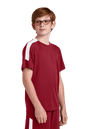 Red and white custom youth soccer jersey by Sport-Tek with team logo, name, and number print, shown from a side view.