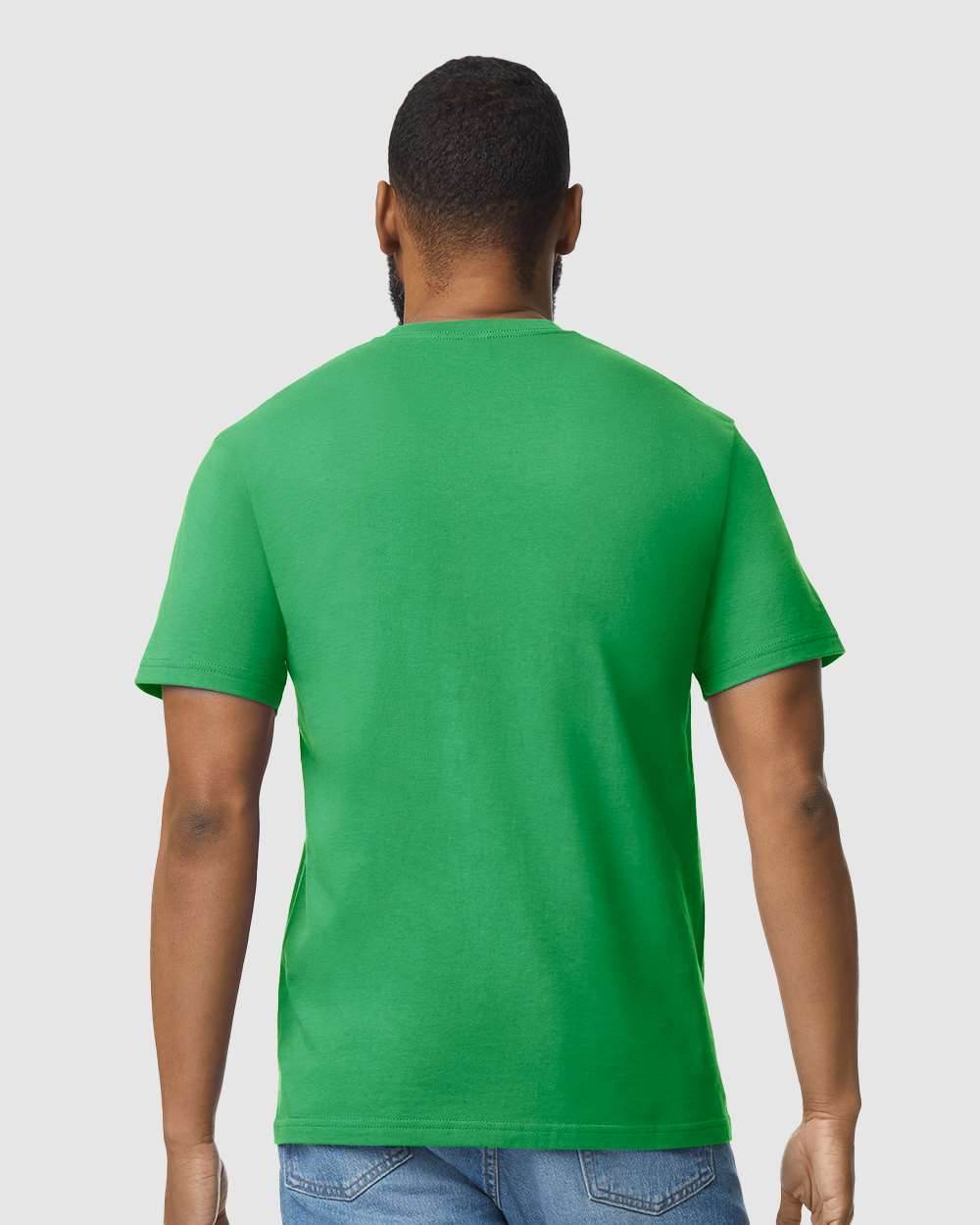Gildan Softstyle midweight T-shirt in Irish Green, front view on model, soft fabric, casual fashion style.