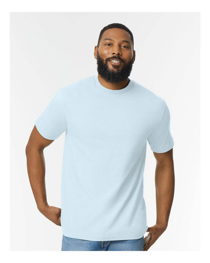 Light blue Gildan Softstyle® midweight T-shirt, front view on a model, showcasing soft fabric and classic fit.