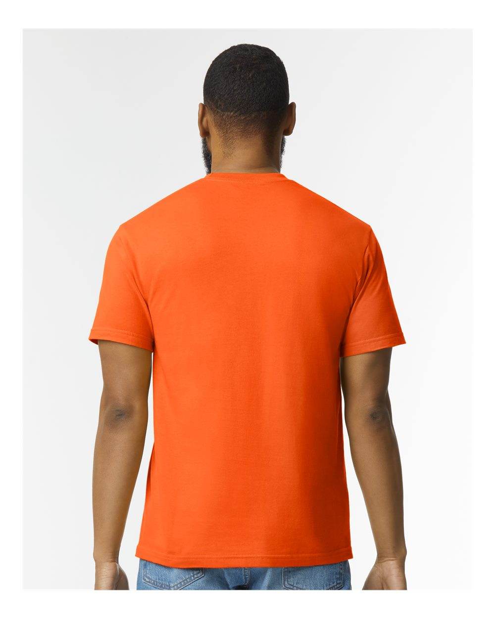 Gildan Softstyle® midweight T-shirt in orange, back view on high model, showcasing soft fabric and relaxed fit.