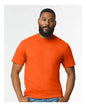 Orange Gildan Softstyle midweight T-shirt with front view, soft fabric and classic fit, model wearing it.