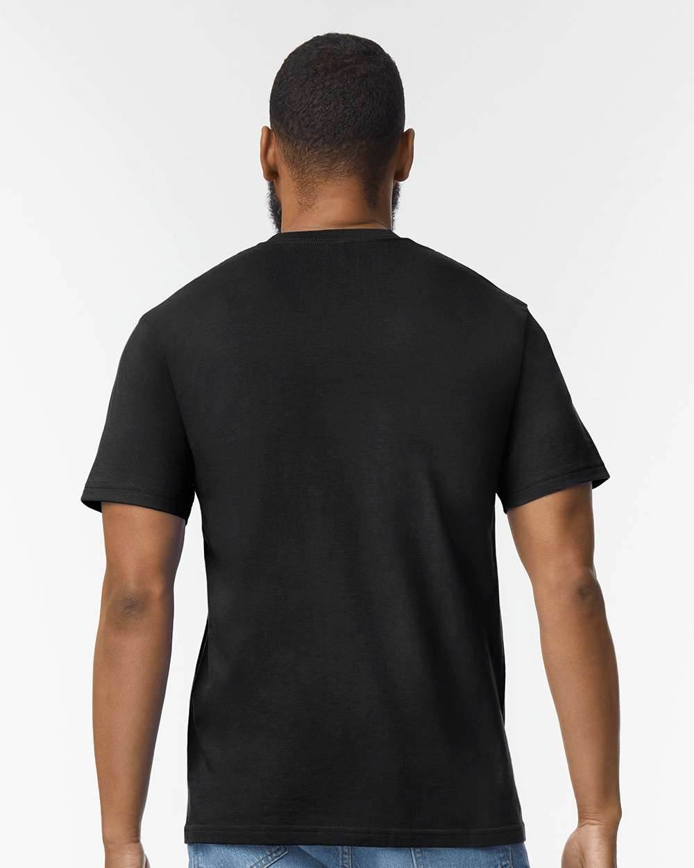 Black Gildan Softstyle midweight T-shirt on a high-model background, showcasing soft fabric and classic fit.