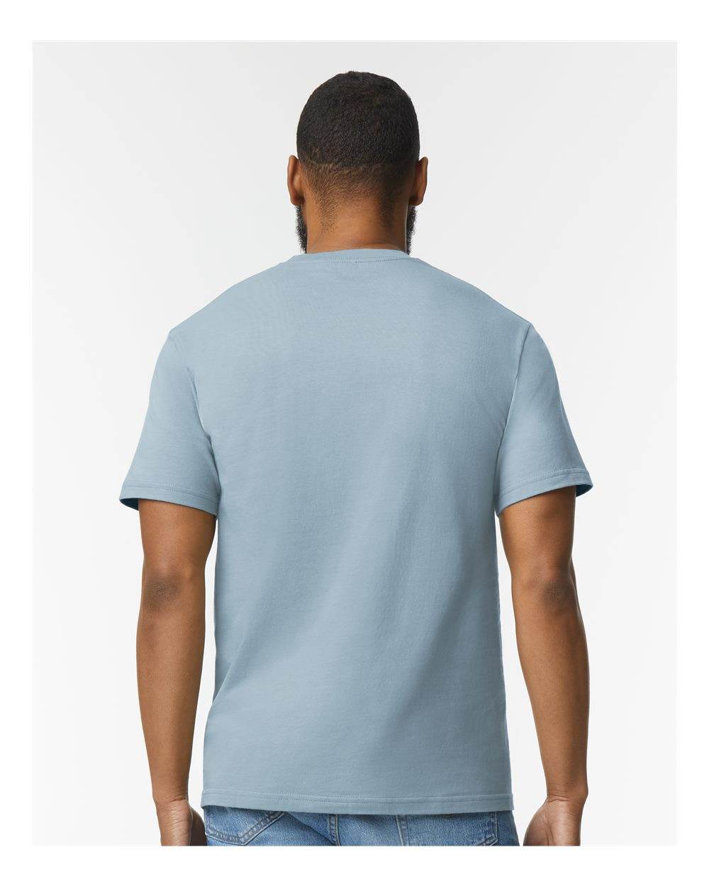 Gildan Softstyle Midweight T-Shirt in stone blue, shown from the back with a high model pose. Soft fashion tee for casual wear.
