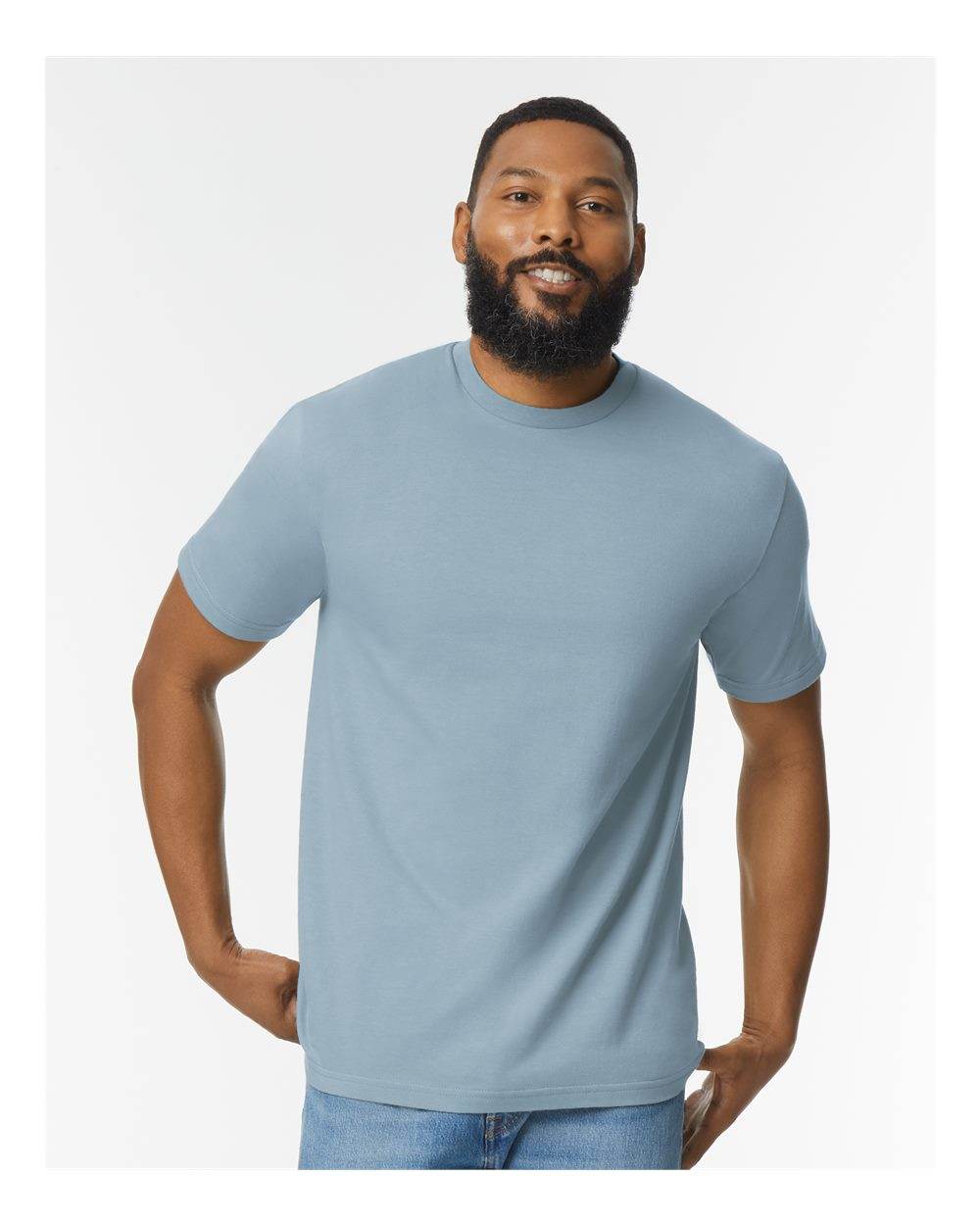 Gildan Softstyle® midweight fashion T-shirt in stone blue, front view on high model, showcasing soft, comfortable fabric.