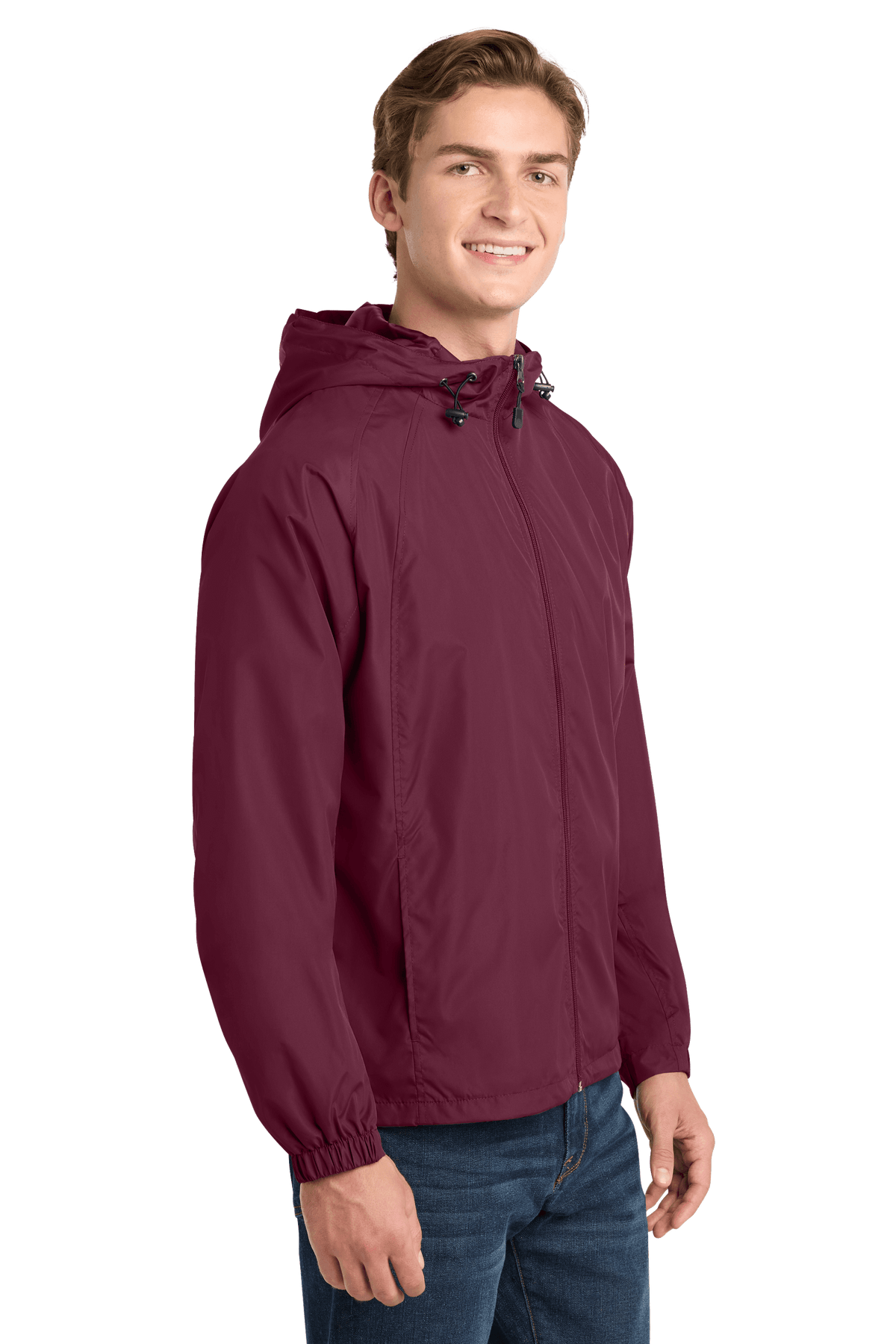 Sport-Tek hooded raglan windbreaker jacket in maroon, shown from the side with a lightweight, sporty design.