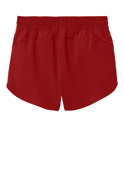 Deep red Sport-Tek® women's Repeat Swift short pant with flat back design, ideal for active wear and comfortable movement.