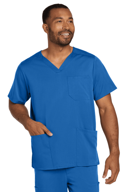 Male nurse wearing Wink Men's Premiere Flex V-Neck Scrub Top in blue, front view showcasing the comfortable print design.
