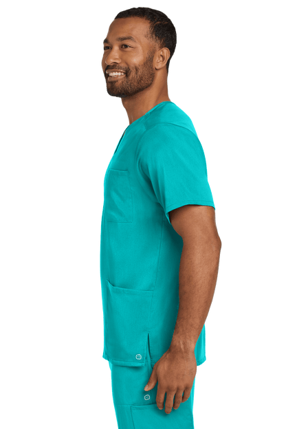 Male nurse wearing teal Wink Premiere Flex™ V-Neck scrub top with print, front view showing comfortable fit and professional style.