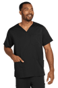 Male nurse wearing Wink Men's Premiere Flex V-Neck Scrub Top in black, front view showing the comfortable, professional design.