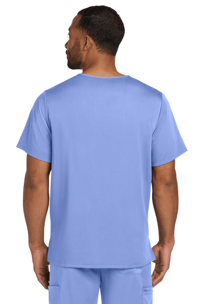 Male nurse wearing Wink Men's Premiere Flex V-Neck scrub top in light blue, showing the front view of the printed design.
