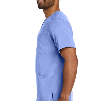 Male nurse wearing flex V-neck scrub top in light blue side