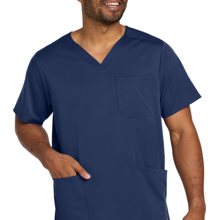 Male nurse wearing navy blue flex V-neck scrub top front