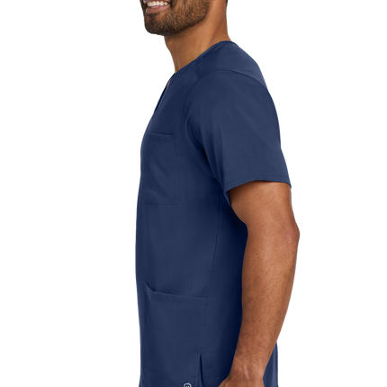 Male nurse wearing navy blue flex V-neck scrub top side