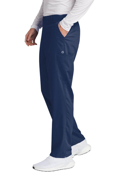 Men's navy blue Wink Premiere Flex cargo scrubs with side pockets, shown from the side view, designed for medical workwear.