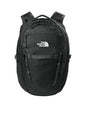 The North Face 31L Royal Arch Backpack in black with front zip pockets and padded shoulder straps, designed for outdoor use.