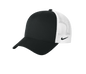 Nike black and white mesh trucker cap with printed design, featuring a classic snapback style and adjustable fit.