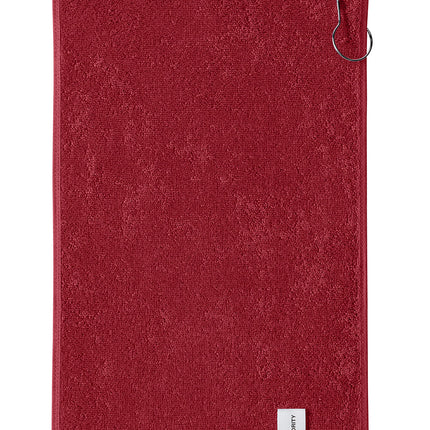 Red Port Authority grommeted hemmed towel with flat back design, suitable for promotional or personal use.
