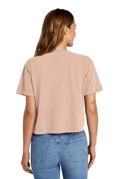 Peach-colored Comfort Colors women's heavyweight garment-dyed boxy crop top with relaxed fit, featuring a custom print on the back.
