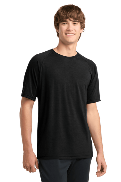 Black Sport-Tek® Ultimate Performance T-shirt ST700 worn by a model, showcasing a fitted athletic design and moisture-wicking fabric.