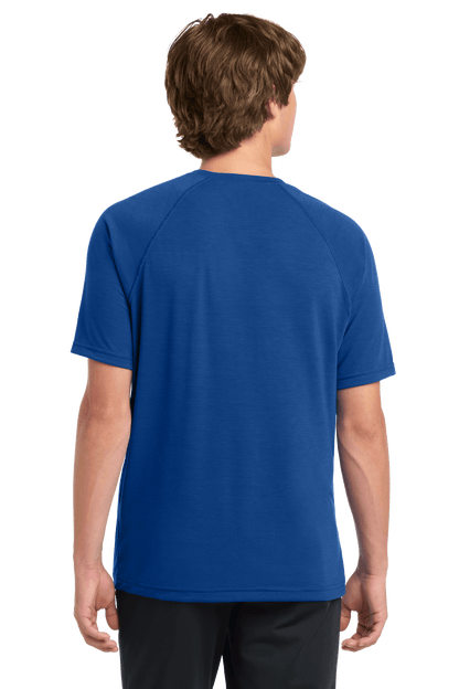 Sport-Tek Ultimate Performance T-shirt ST700 in true royal color, shown from the back on a model, highlighting its athletic fit and fabric.
