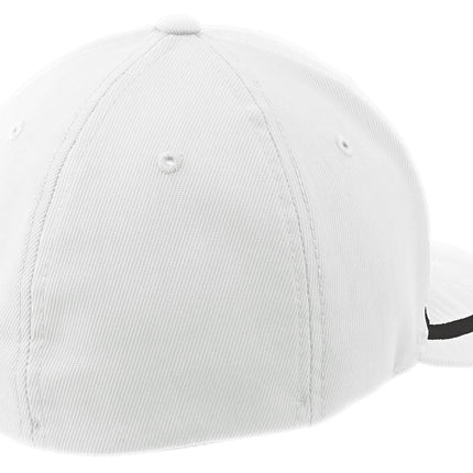 White and black Sport-Tek Flexfit performance colorblock cap with curved brim and adjustable fit, shown from back view.