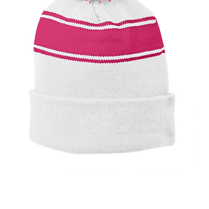 White and pink Sport-Tek stripe pom pom beanie with a front view, showcasing its cozy knit design and colorful striped pattern.
