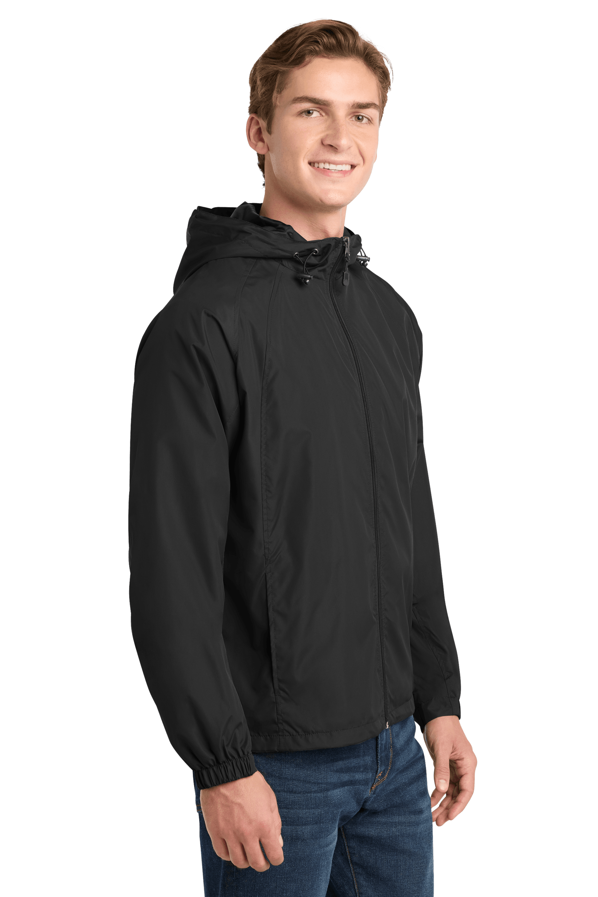 Black Sport-Tek hooded raglan windbreaker jacket worn by a model, featuring a front zipper and sporty design.