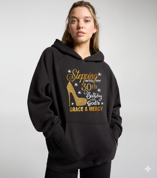 Lane 7 hooded sweatshirt with the design "Stepping into My 30th Birthday With God's Grace and Mercy" in black and white text.