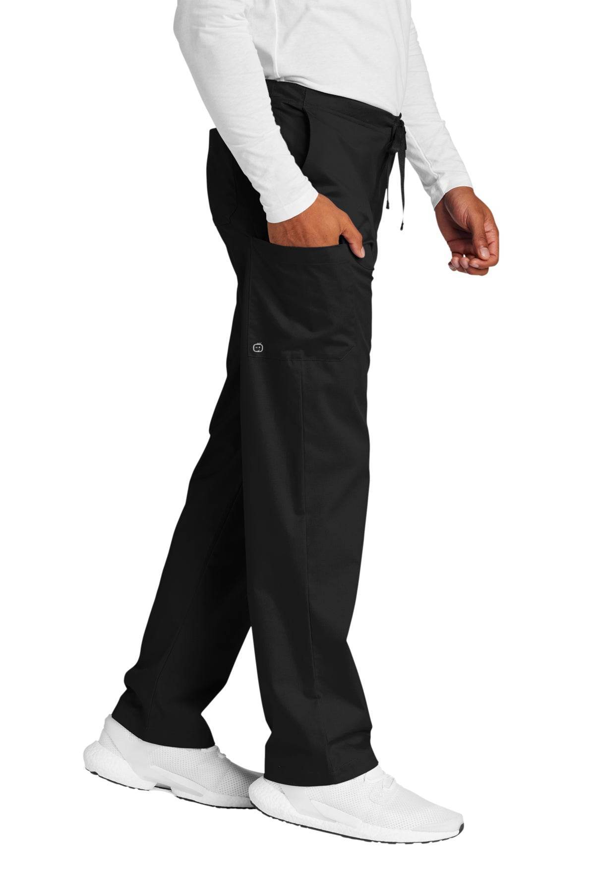 Black unisex medical workwear scrubs with cargo pockets, shown from the side view, by Wink.