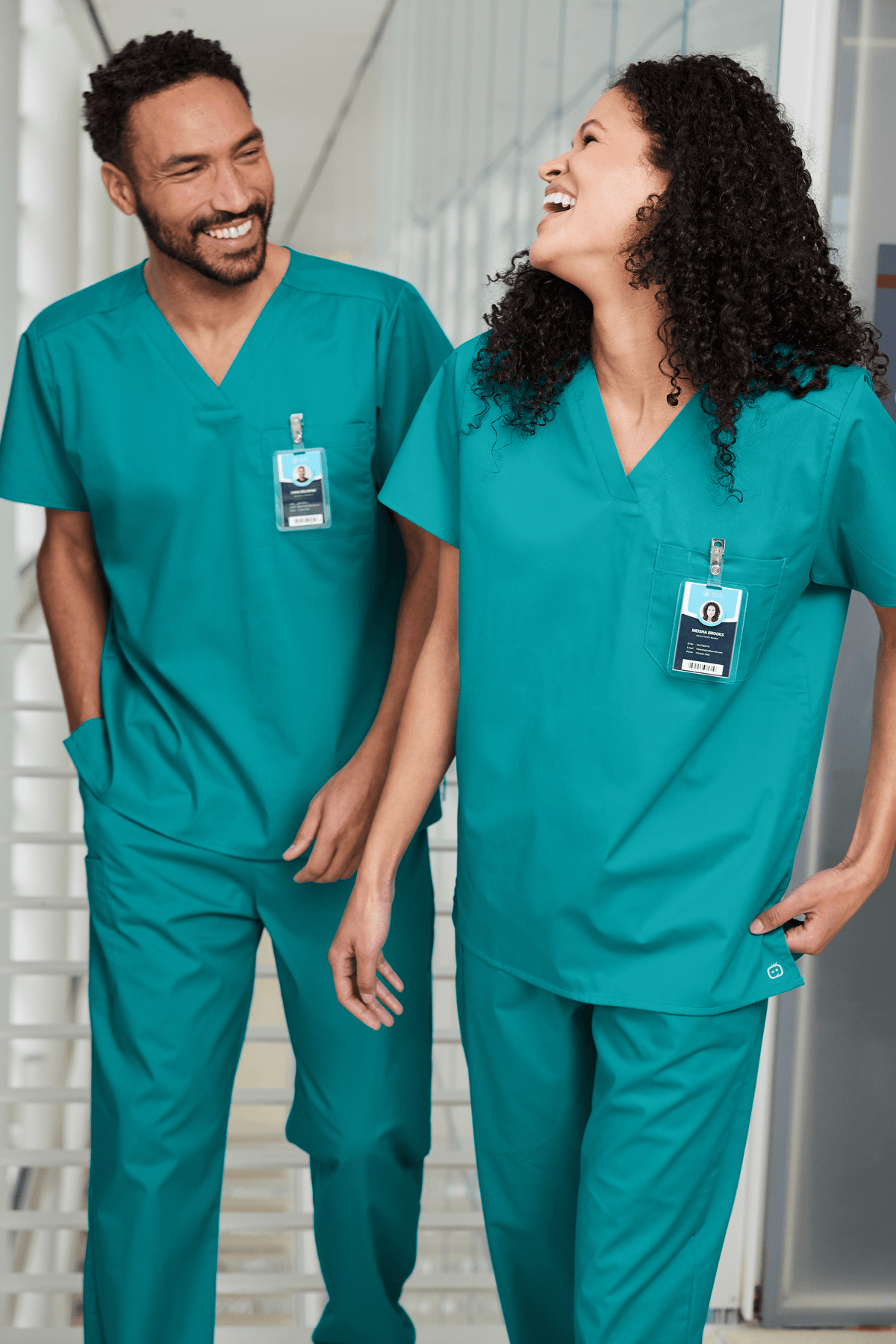 Unisex Wink medical scrubs top with V-neck and flexible chest pocket, shown in print view, designed for healthcare professionals.