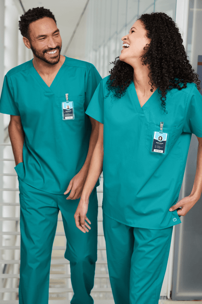 Unisex Wink medical scrubs top with V-neck and flexible chest pocket, shown in print view, designed for healthcare professionals.