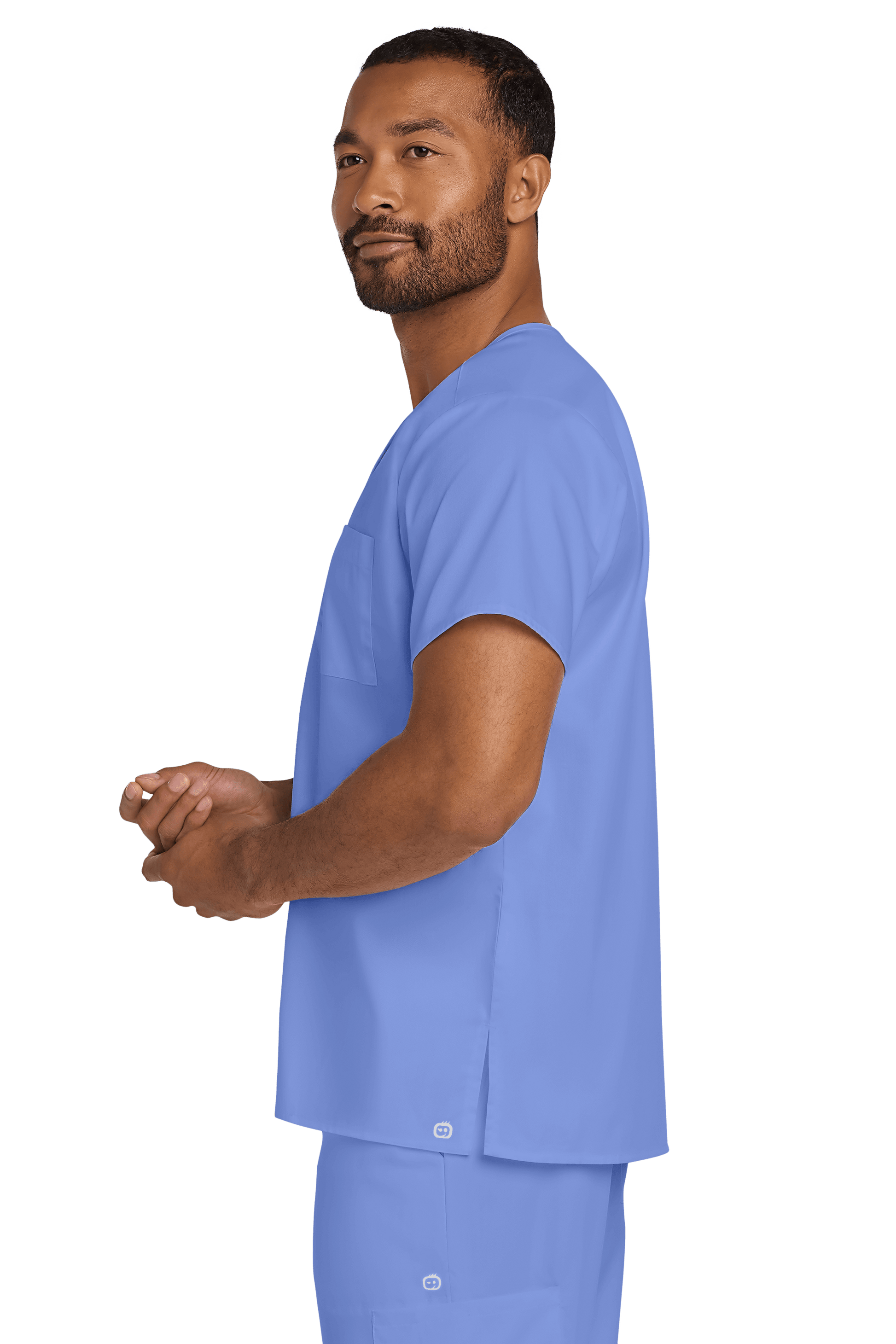 Light blue unisex medical scrub top with V-neck and flexible chest pocket, designed by Wink, shown from side view.