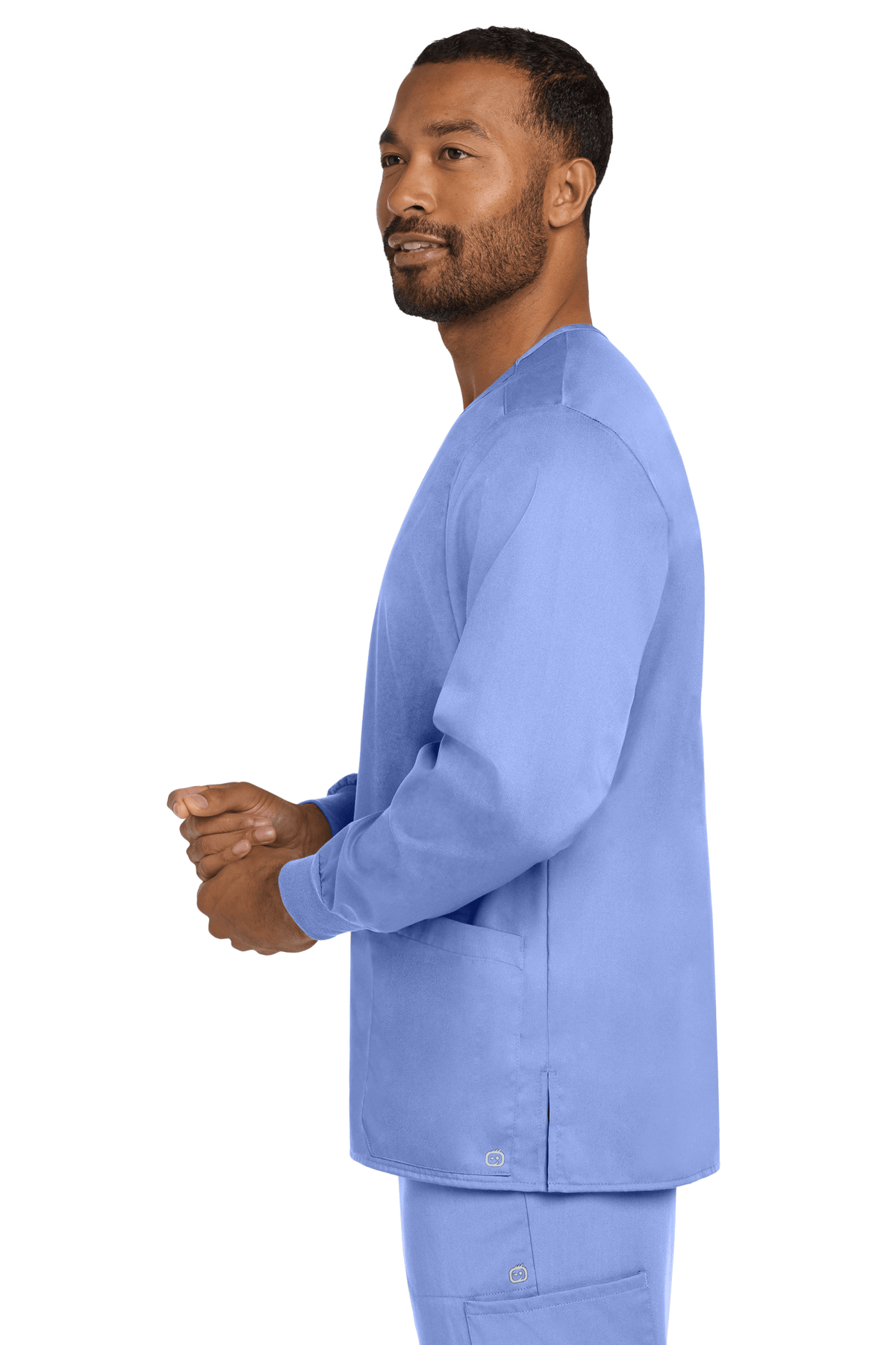 Light blue unisex workwear scrub jacket by Wink with snap front, shown from the side view, perfect for medical professionals.