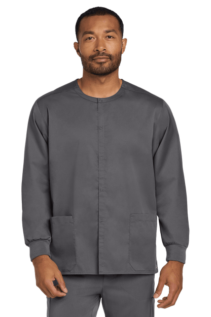 Unisex Wink workwear scrub jacket in pewter grey with snap front, flexible fabric, worn by a model showing front view.