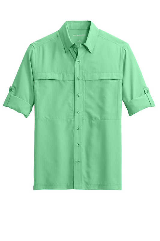 Bright seafoam green Port Authority® Long Sleeve UV Daybreak Shirt laid flat, showing front view and lightweight fabric.