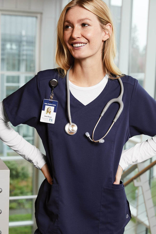 Women’s long sleeve scrub tee by Wink with printed view, showing a comfortable, fitted design ideal for medical professionals.