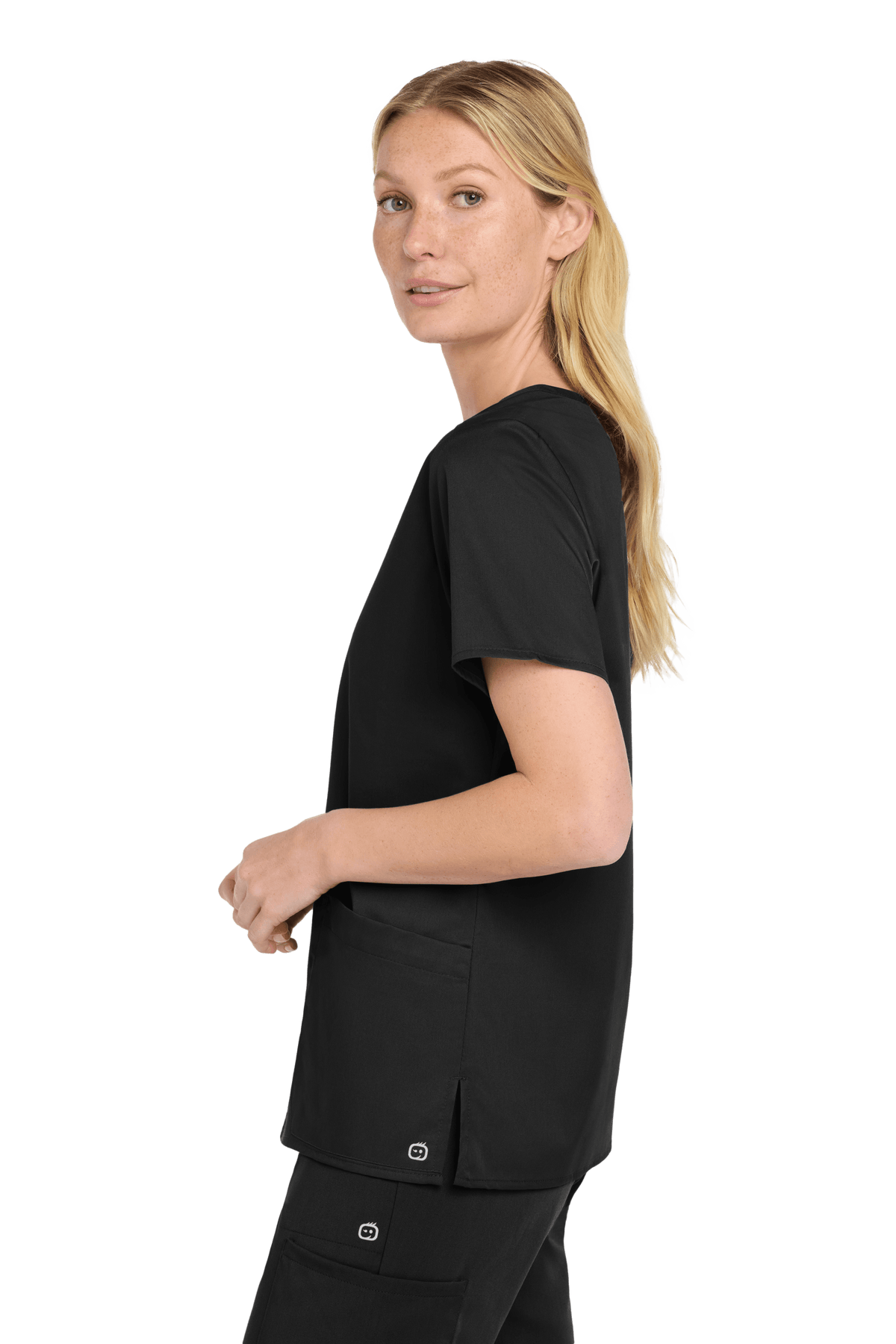 Black women's Medical WorkFlex™ mock wrap scrub top with printed design, shown from side view on a female model.