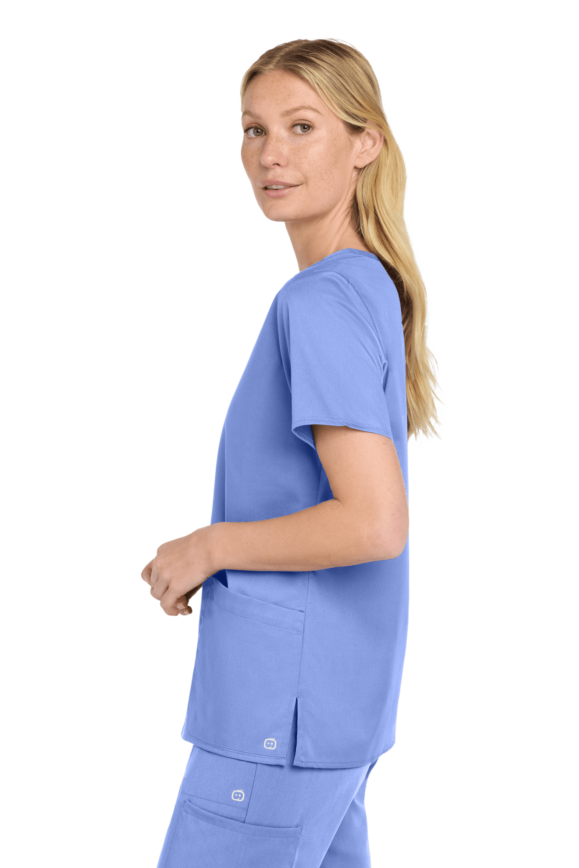 Light blue Women's Medical WorkFlex™ Mock Wrap Top by Wink, featuring a stylish scrub print, shown from the side view.