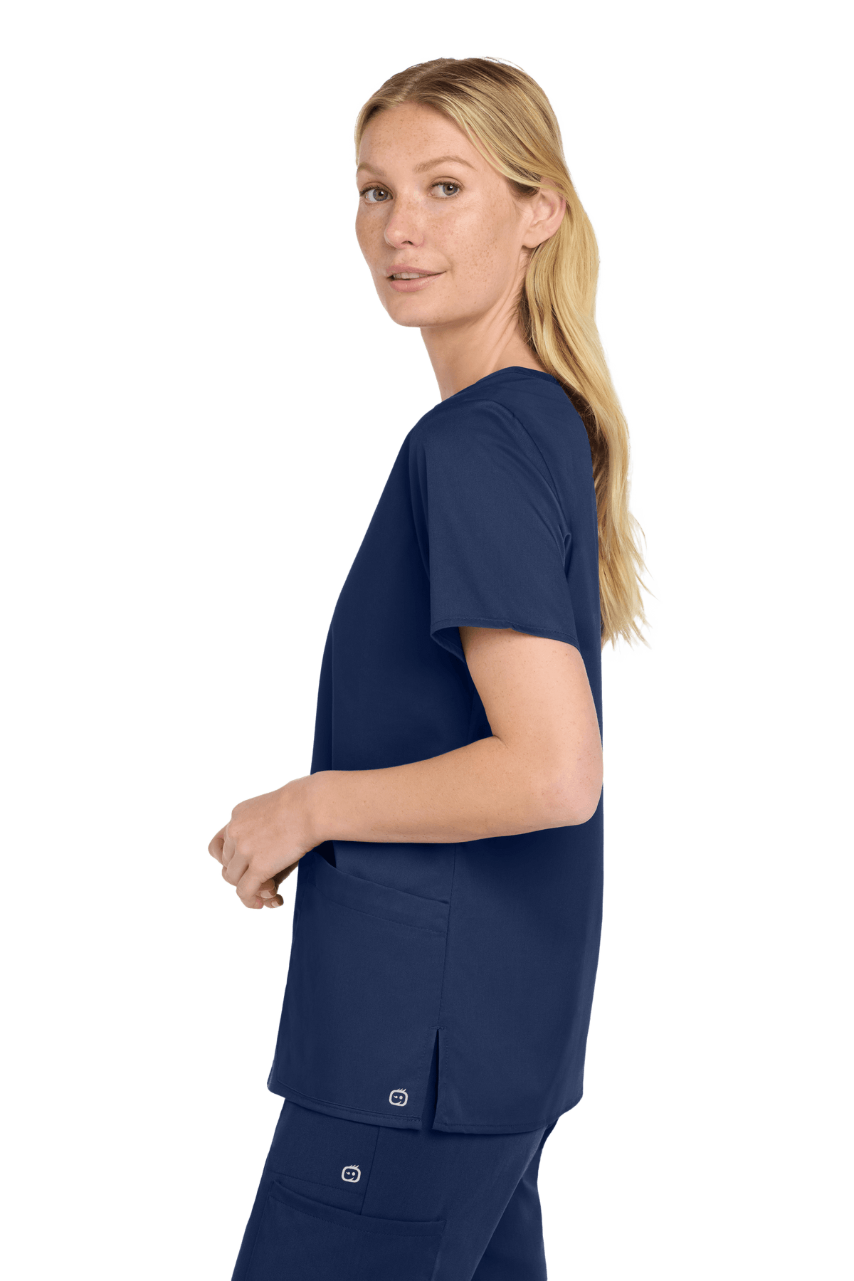 Women’s Wink Medical WorkFlex™ mock wrap scrub top with navy print, shown from side view, designed for comfortable medical workwear.