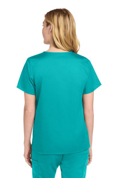 Wink Women's Medical WorkFlex™ mock wrap scrub top in teal with printed design, shown from the back on a female model.